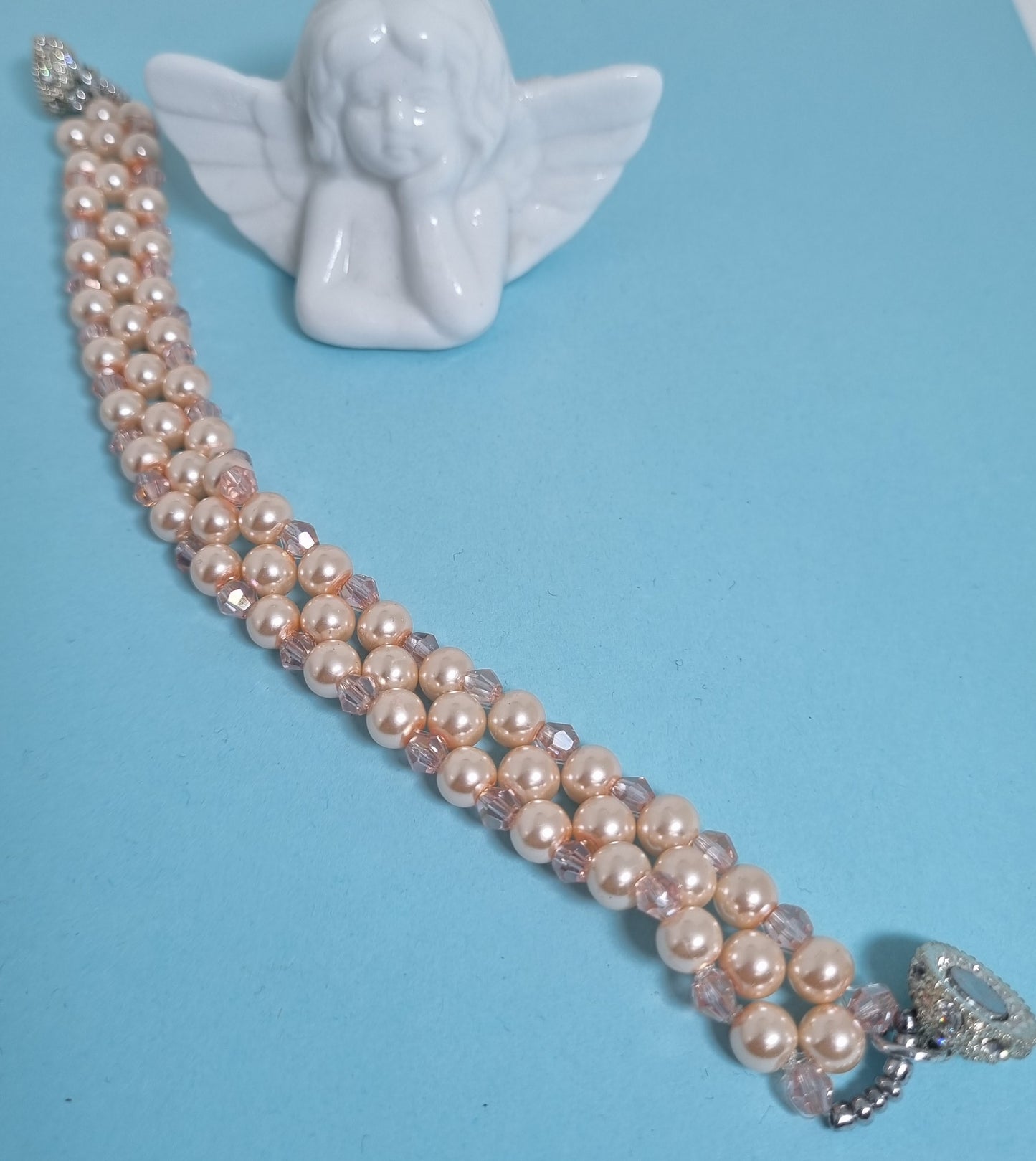 Bracciale LE PERLE .027 fascia intreccio perline rosa e cristalli.