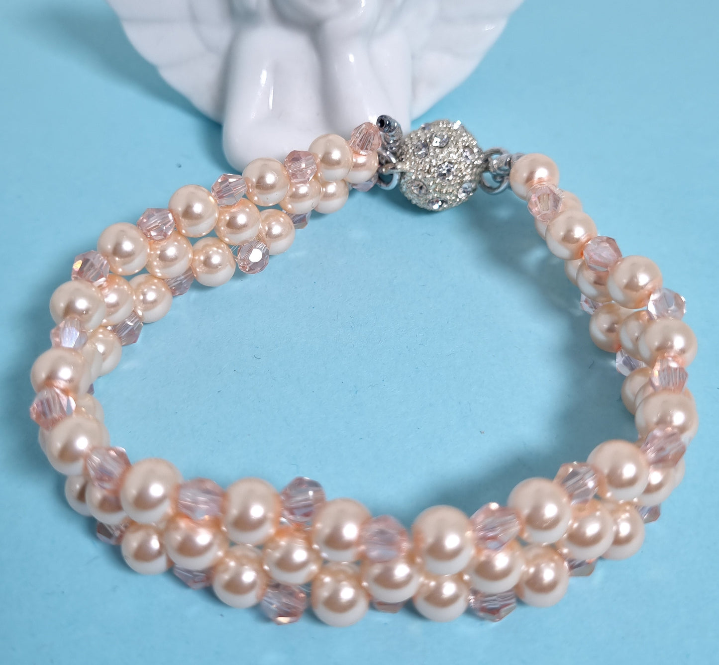 Bracciale LE PERLE .027 fascia intreccio perline rosa e cristalli.