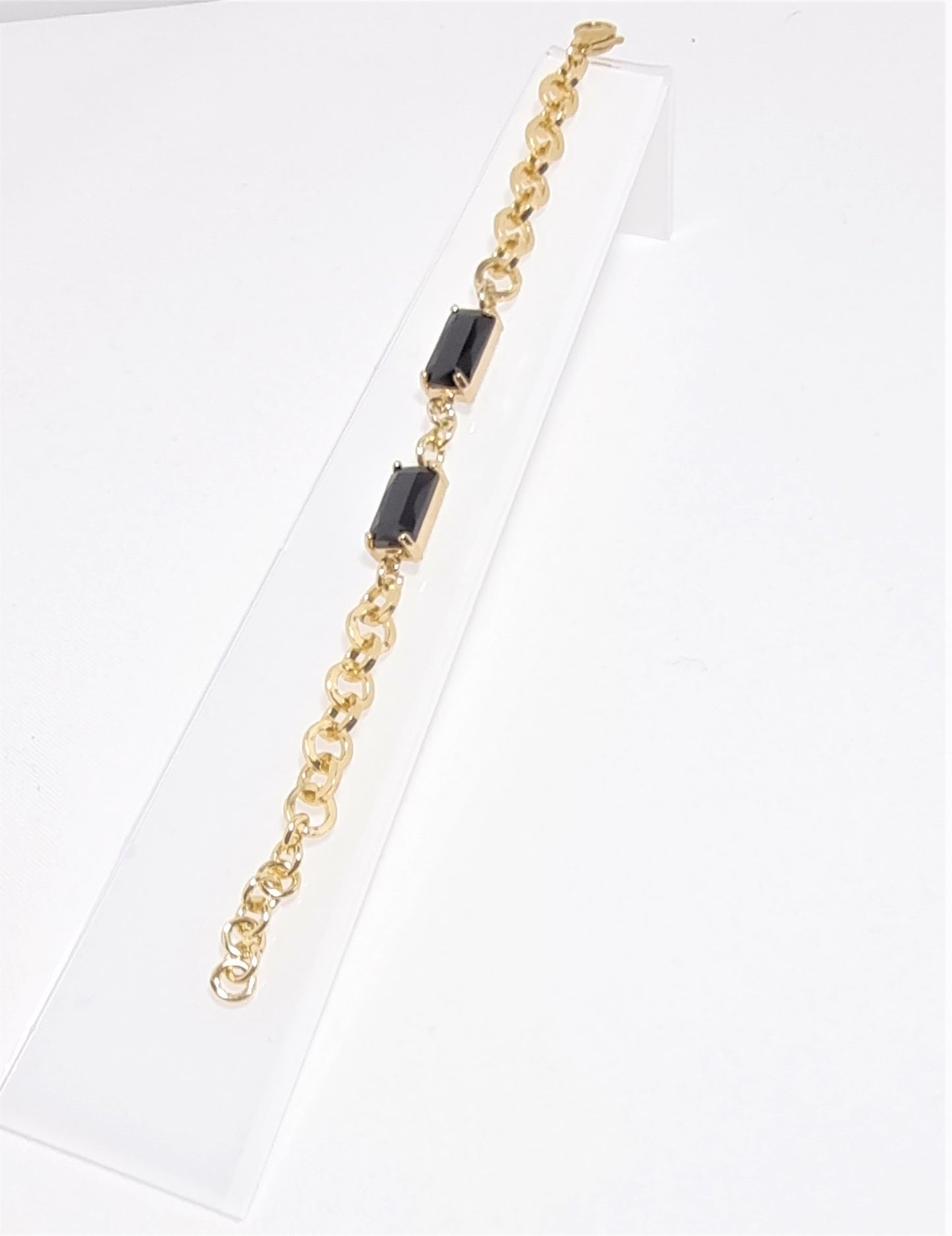 Orecchini GRACE i metalli .011 maglie metallo dorato, strass e cristalli neri incastonati.