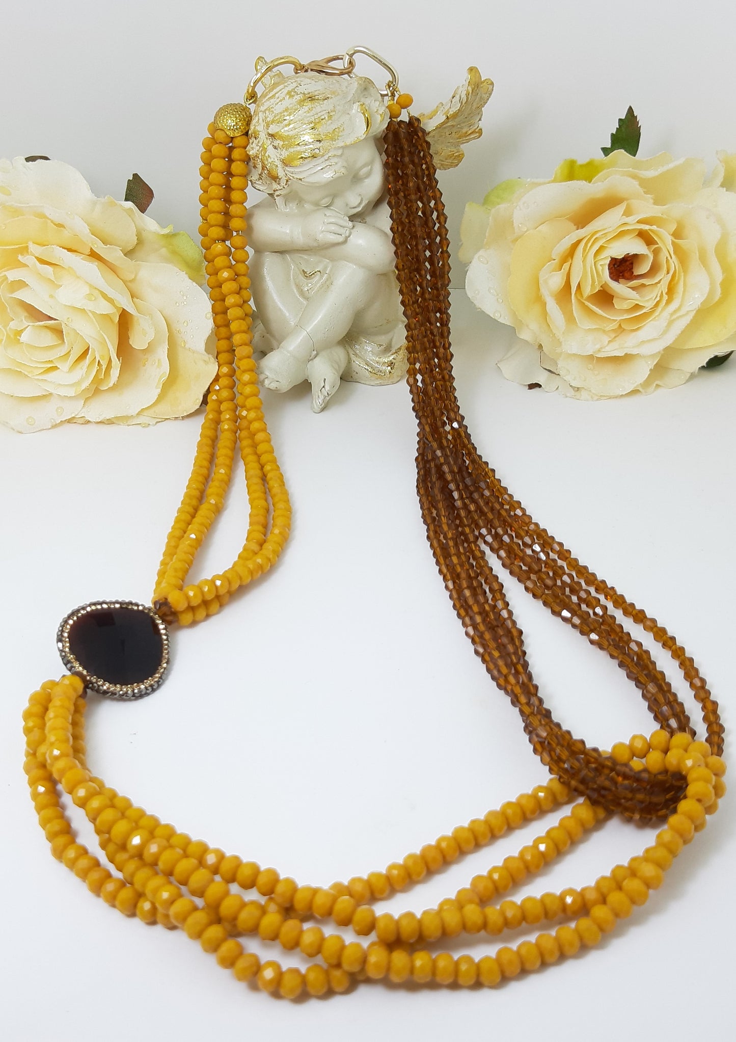 Collana I CRISTALLI .059 cristallo giallo e ocra trasperente a nodo e grande cristallo in marcassite.