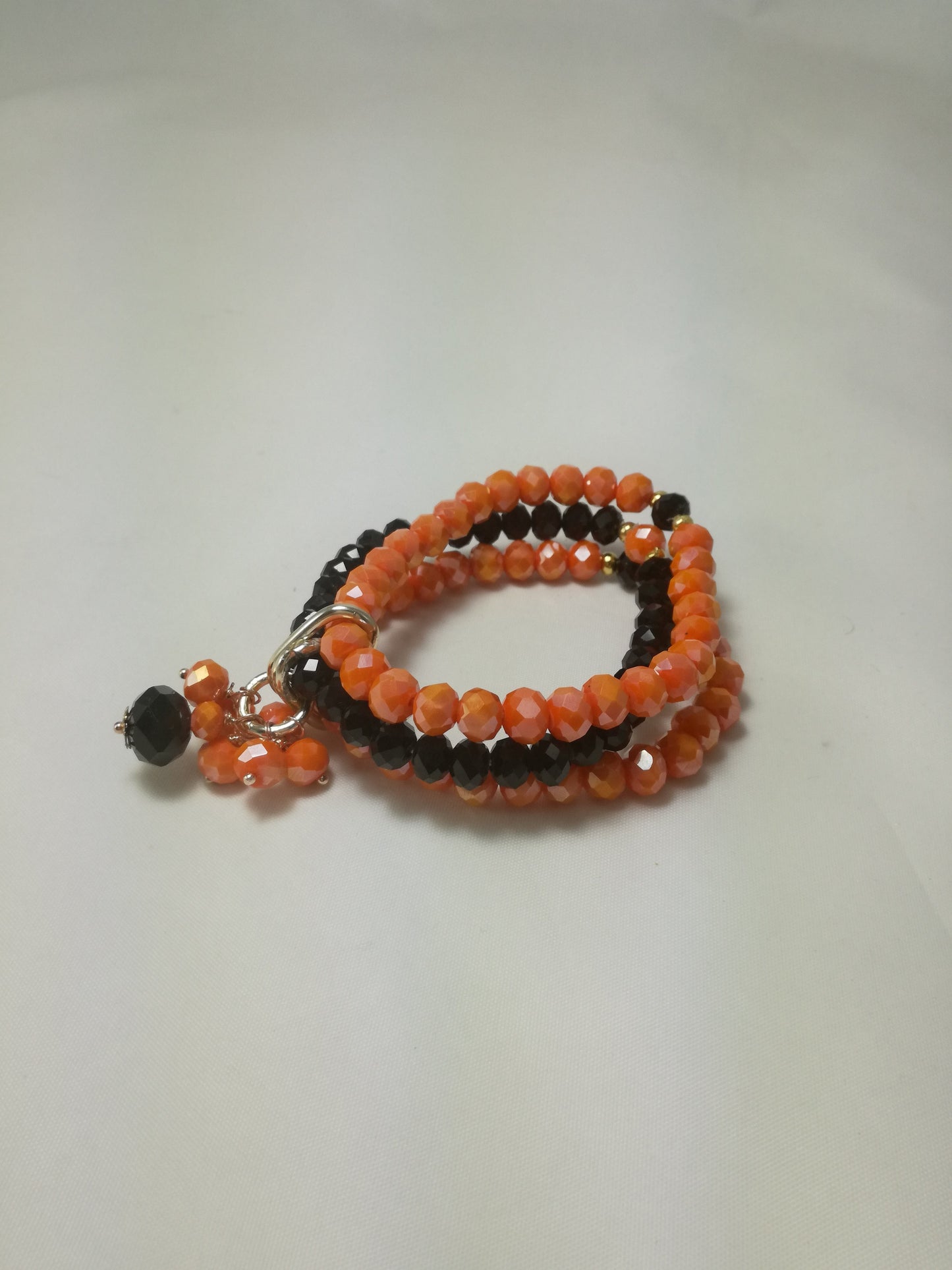 Bracciale I CRISTALLI .083 fili elastici cristalli arancio, nero.