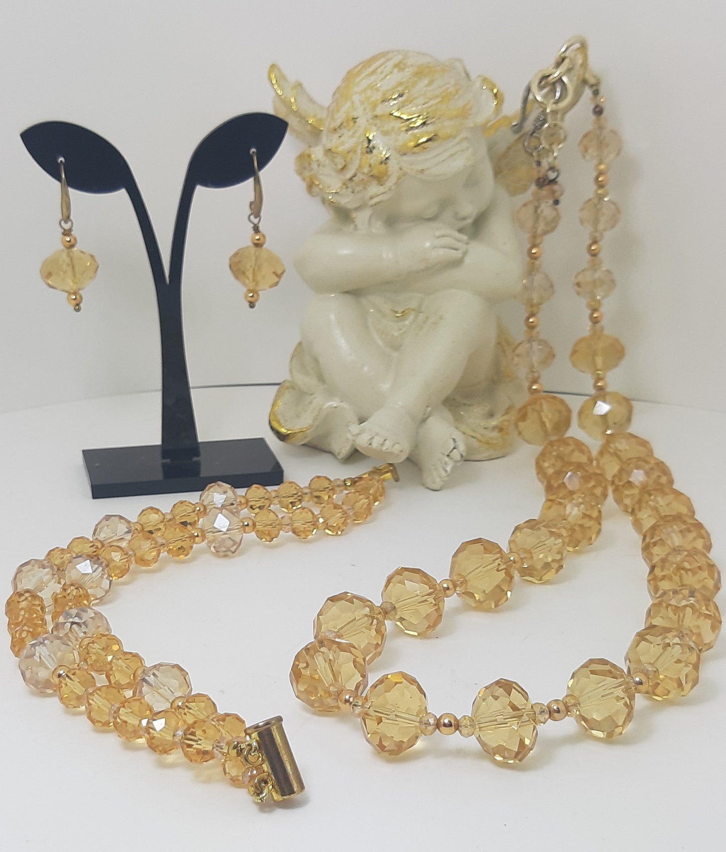 Collana I CRISTALLI .016 collier grandi cristalli color champagne distanziati.