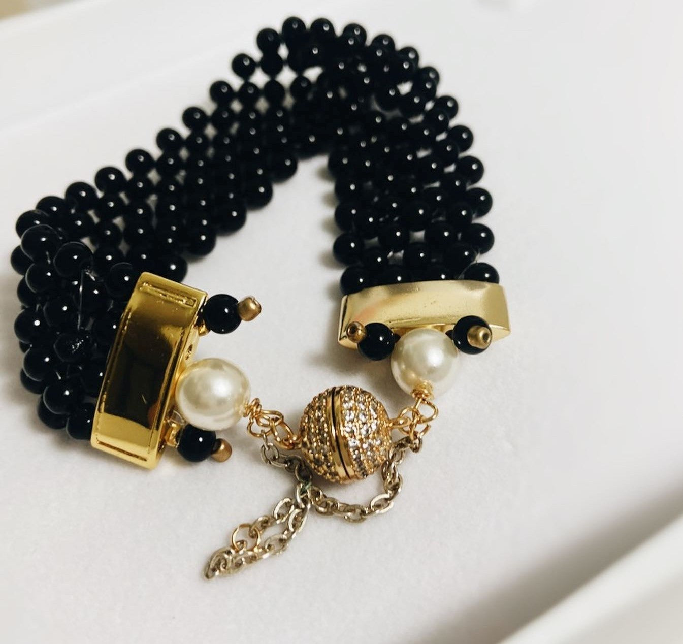LUXURY Orecchini .001, piccoli onici, perla finale
