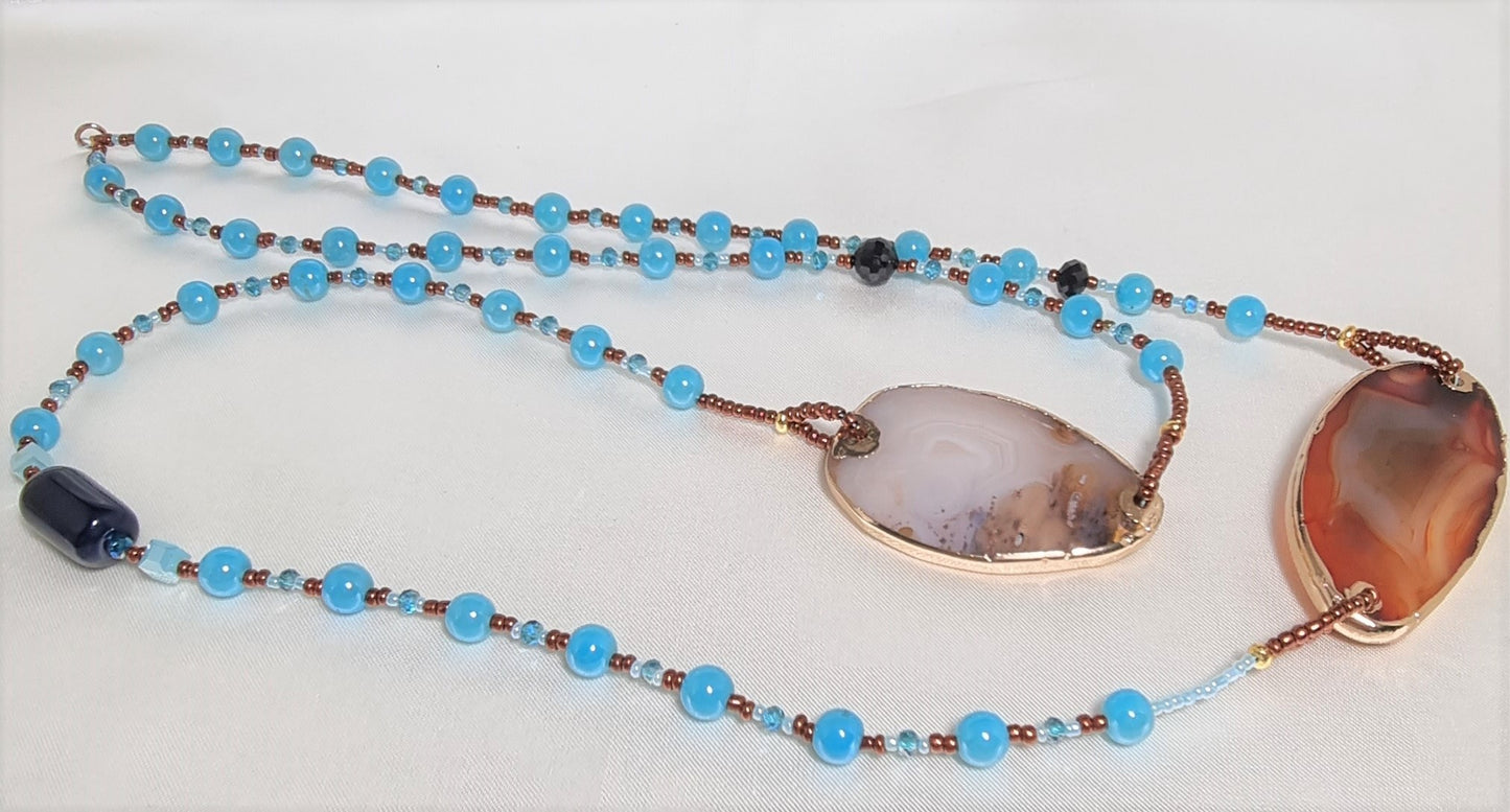 Collana ZELDA .087 lunga, distanziatori in pietra naturale e perline bronzo e azzurre.