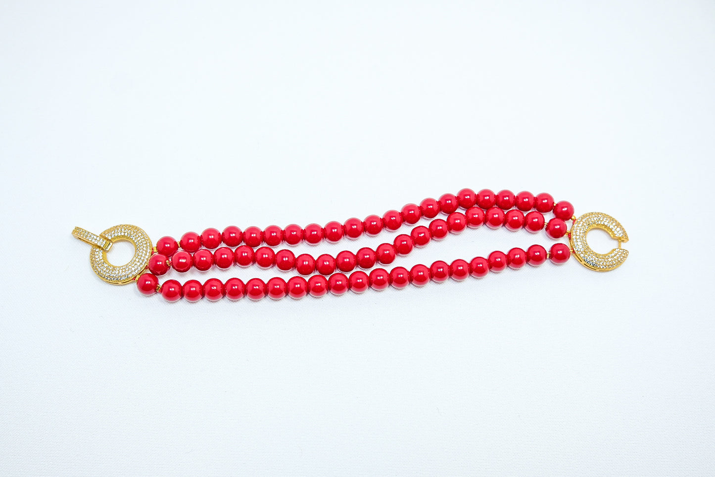 Bracciale I ROSSI .018 fascia tre fili perle rosso chiusura metallo dorato e strass.