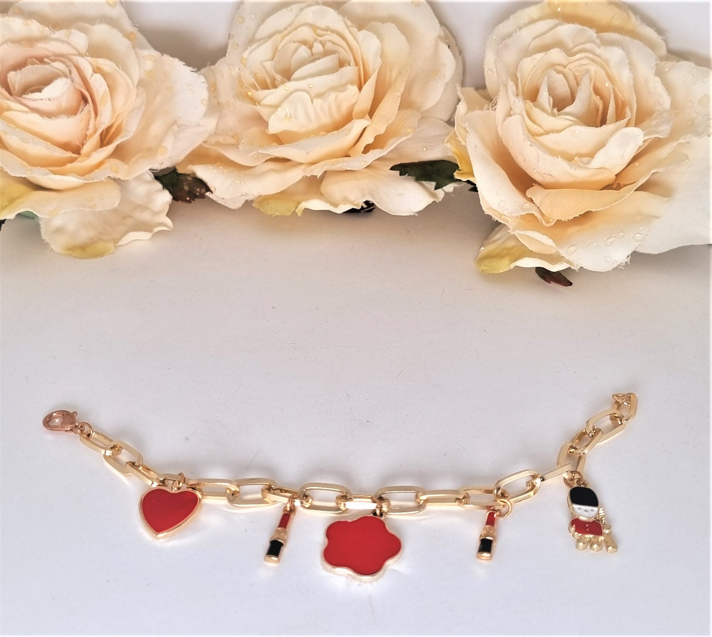 Bracciale LE RAGAZZE .008 maglie dorate e charms smaltate.