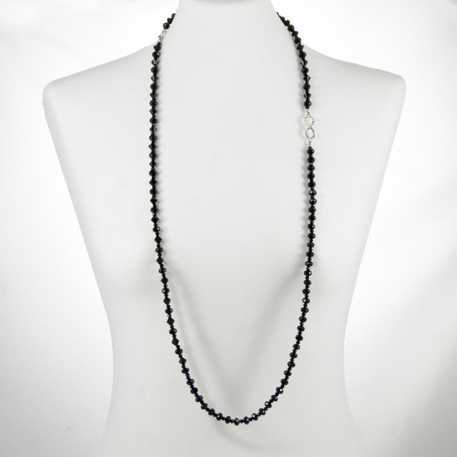 Collana LUCEOMBRA .009, unico lungo filo di cristalli neri. motivo infinito metallo e strass.