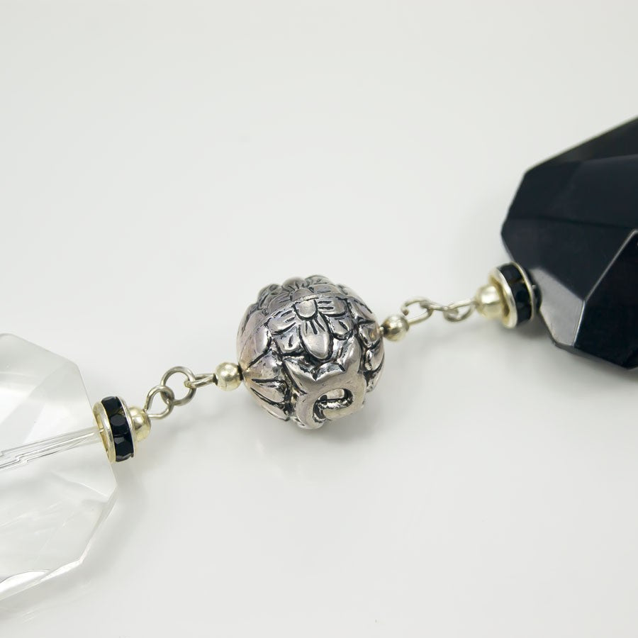 Collana LUCEOMBRA .012, grandi cristalli neri e trasparenti, maglie metallo, elementi a sfera e strass.