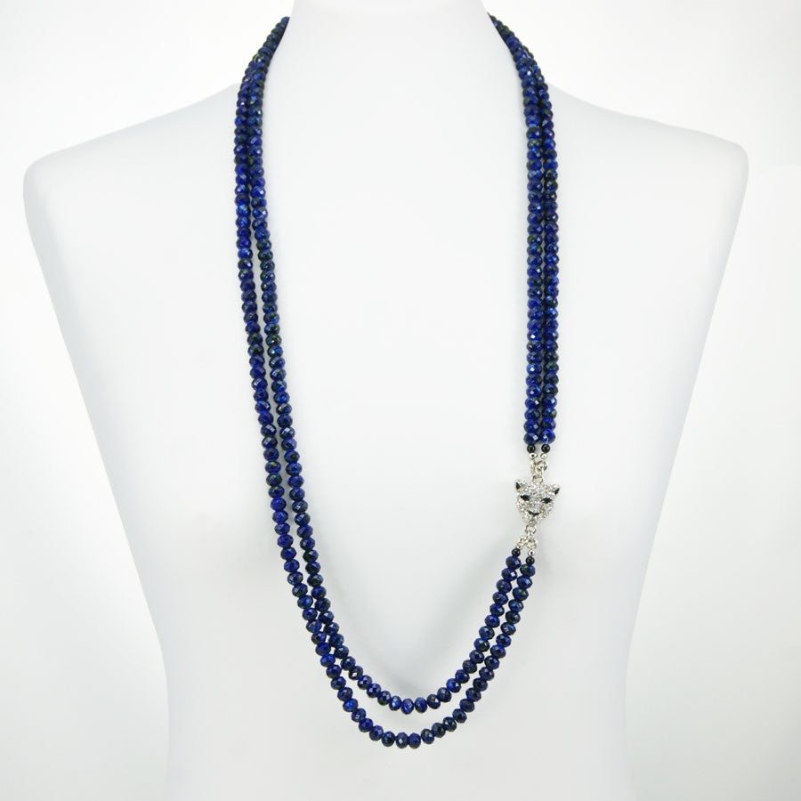 Collana I CRISTALLI .012, due fili mezzi cristalli blu screziati con elemento separatore metallo.