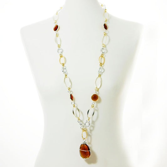 Collana ZELDA .009 lunga, maglie, cristalli e pendente color ambra incastonati.