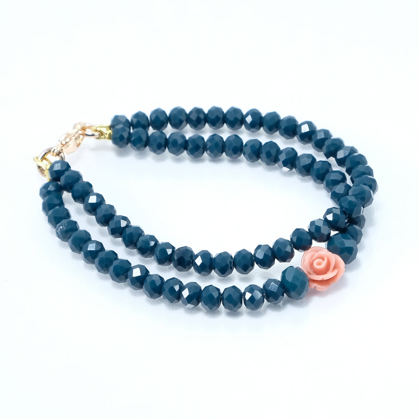 Bracciale LE ROSE .006 cristalli verdi e una rosellina rosa antico.