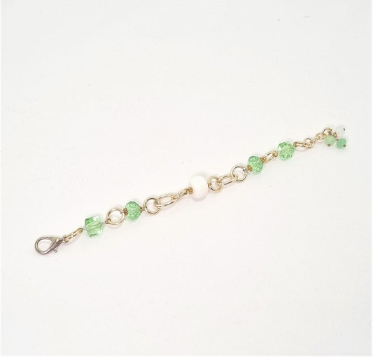 Bracciale I CRISTALLI .094 cristalli verde prato , maglie dorate e bauletto bianco