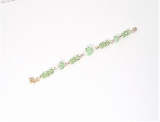 Bracciale I CRISTALLI .093a Cristalli verde prato , maglie dorate.