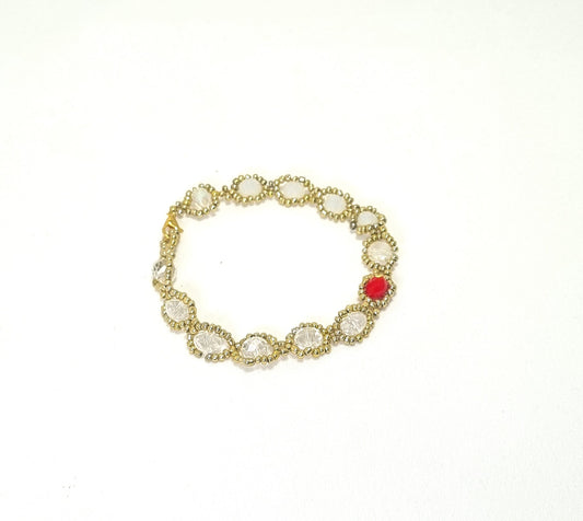Bracciale I CRISTALLI .018 un filo di cristalli trasparenti incorniciati perline dorate