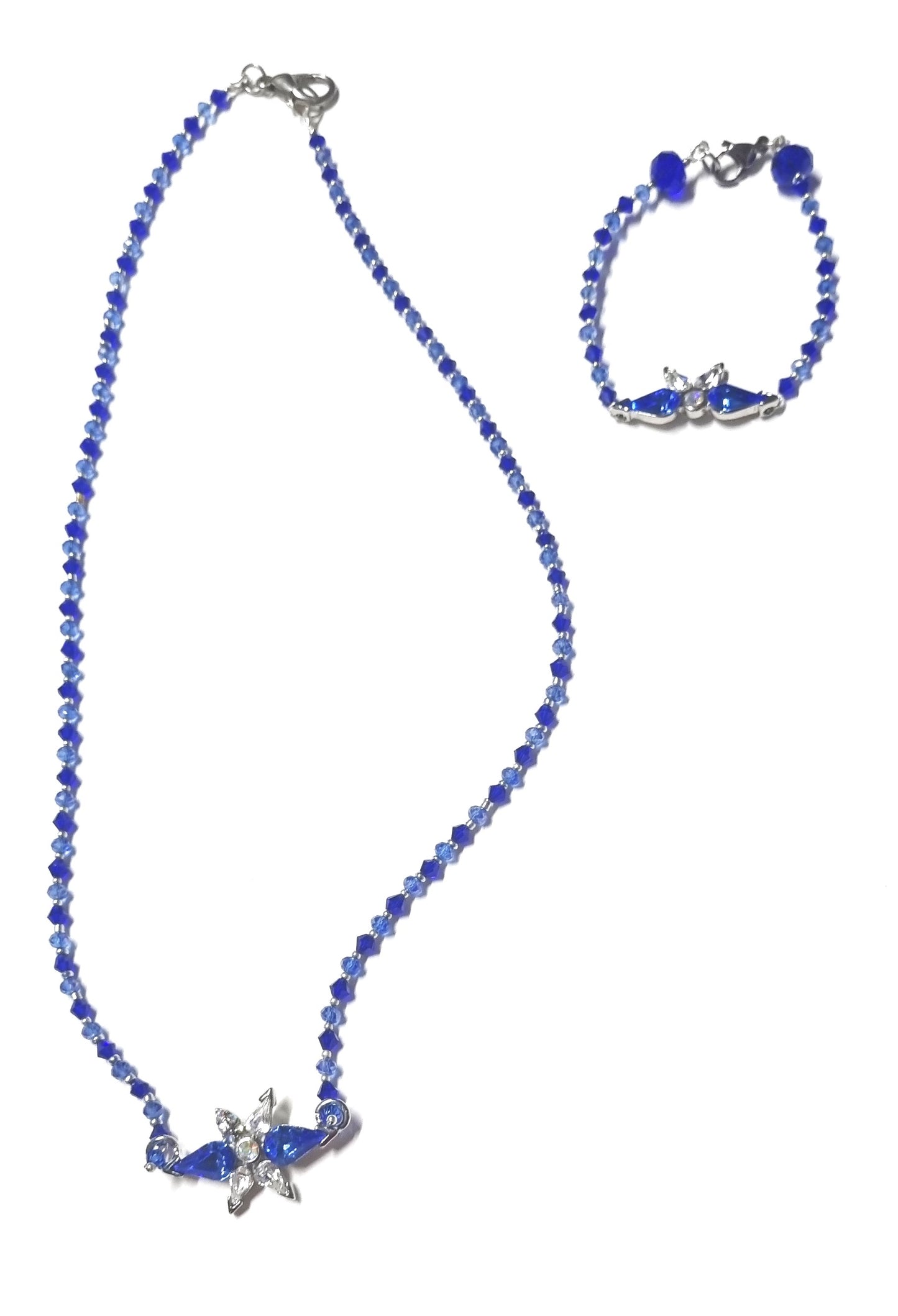 Bracciale I CRISTALLI .087a Piccoli cristalliazzurri/blu elettrico alternati centrale metallo e cristalli in tono.