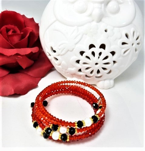 Bracciale I ROSSI .022 spirale cristalli rosso/arancio, perle, cristalli.