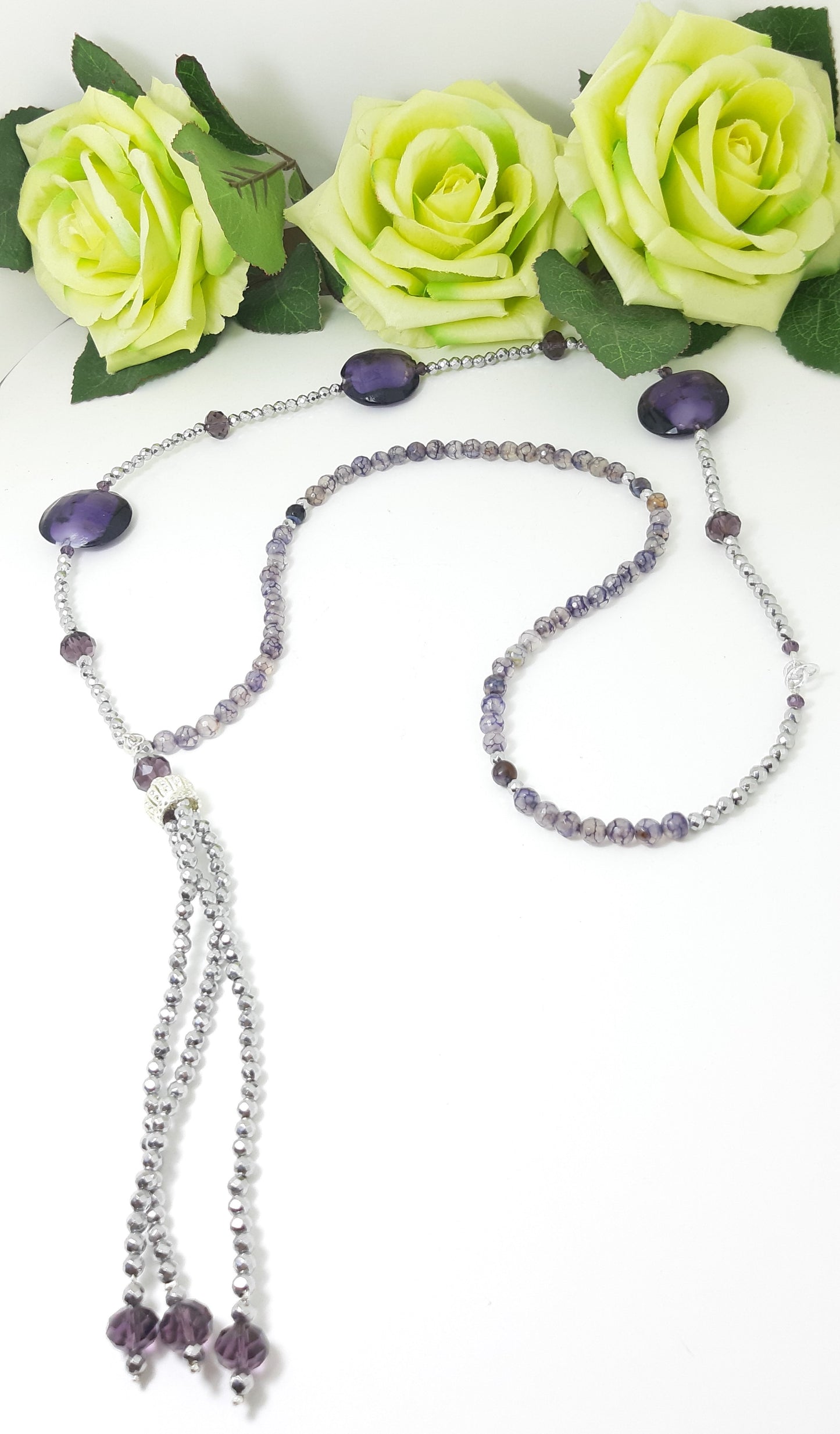 Orecchini ZELDA .036 lunghi  in ematite color argento e cristallo viola.