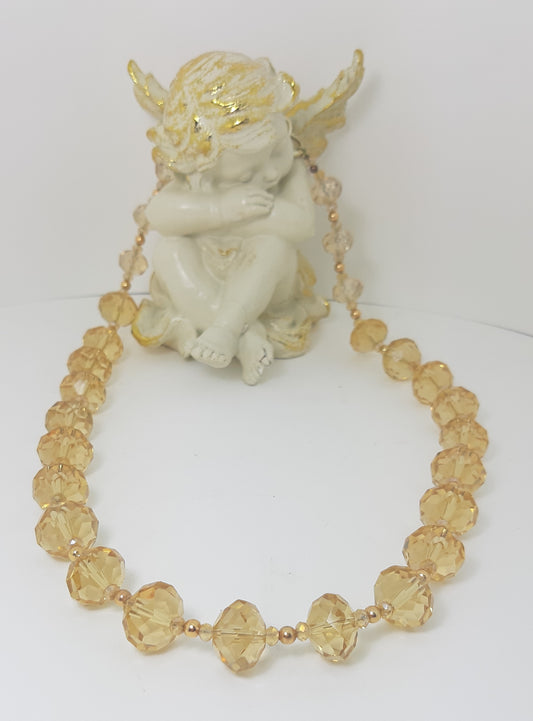 Collana I CRISTALLI .016 collier grandi cristalli color champagne distanziati.
