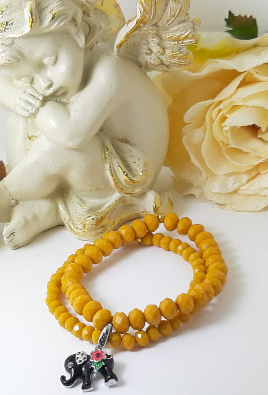 Bracciale I CRISTALLI .063  perline giallo ocra elastici e charms elefantino.