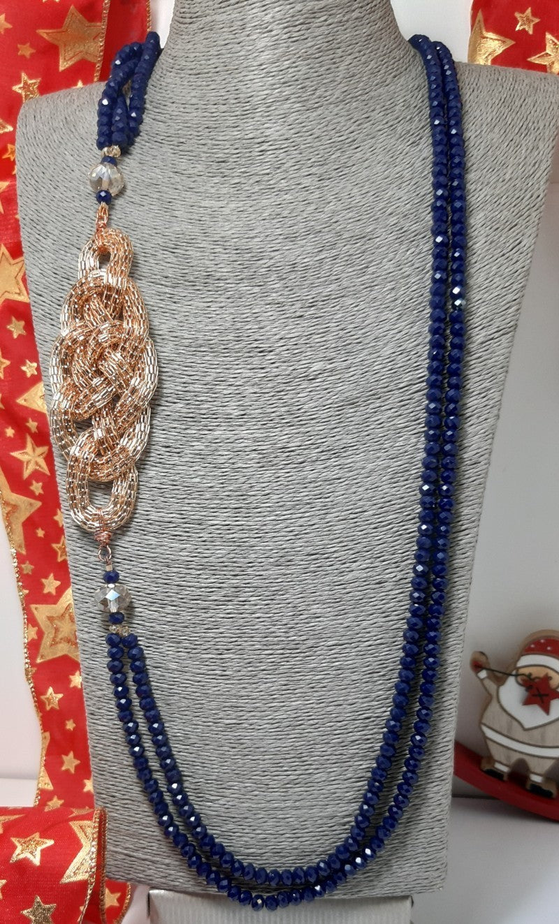 Collana I CRISTALLI .081 cristalli blu notte con intreccio laterale metallo ramato.