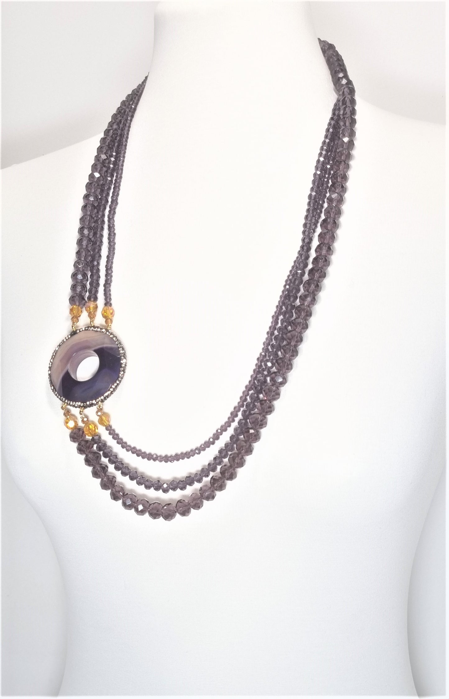 Collana I CRISTALLI .101 tre fili cristalli austriaci, quarzo viola,marcassite.