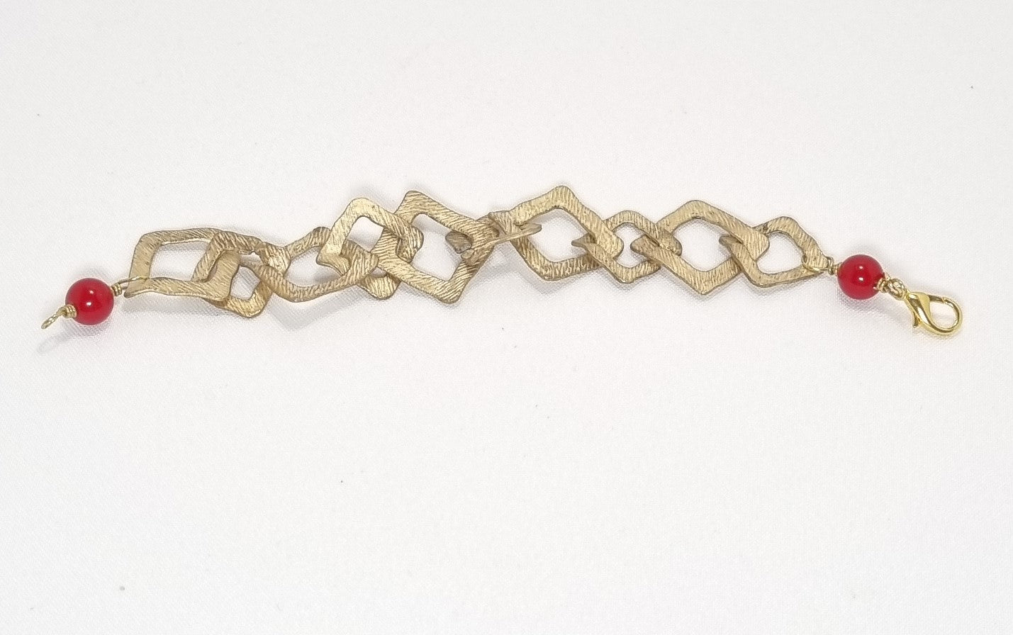 Bracciale I ROSSI .036 maglia quadra in zama, due perle rosse.