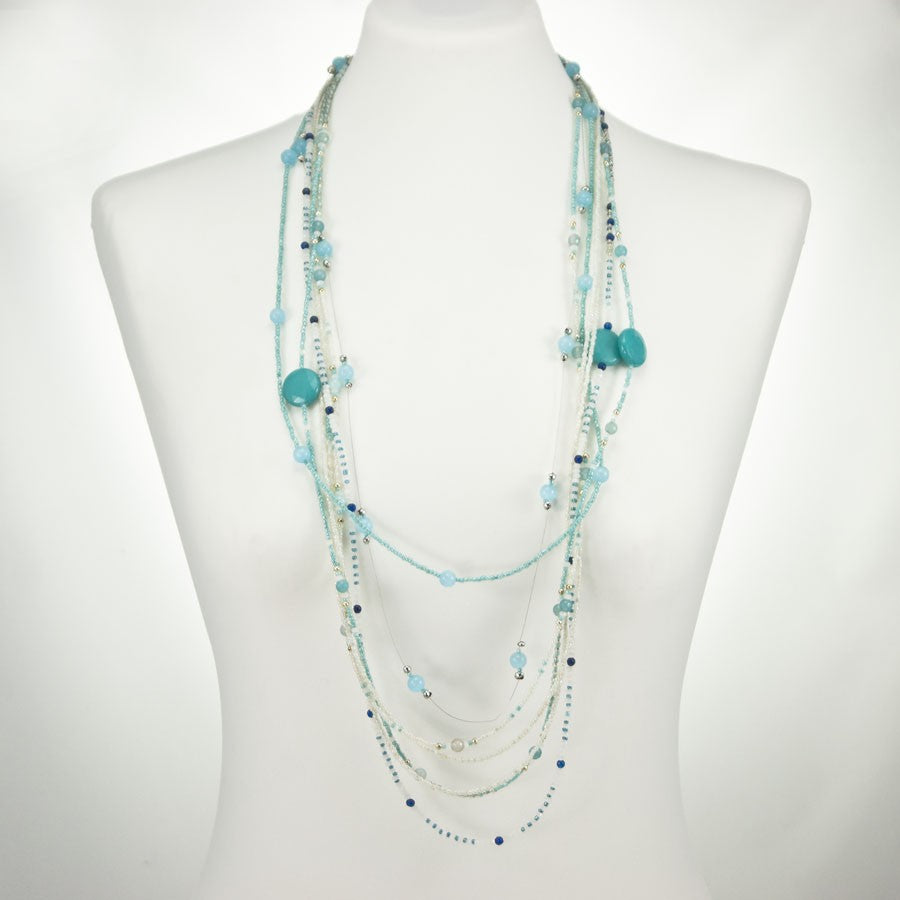 Collana SOPHIA i colori .004, cristalli, rocailles e fili sospesi, toni azzurro e bianco e turchese.