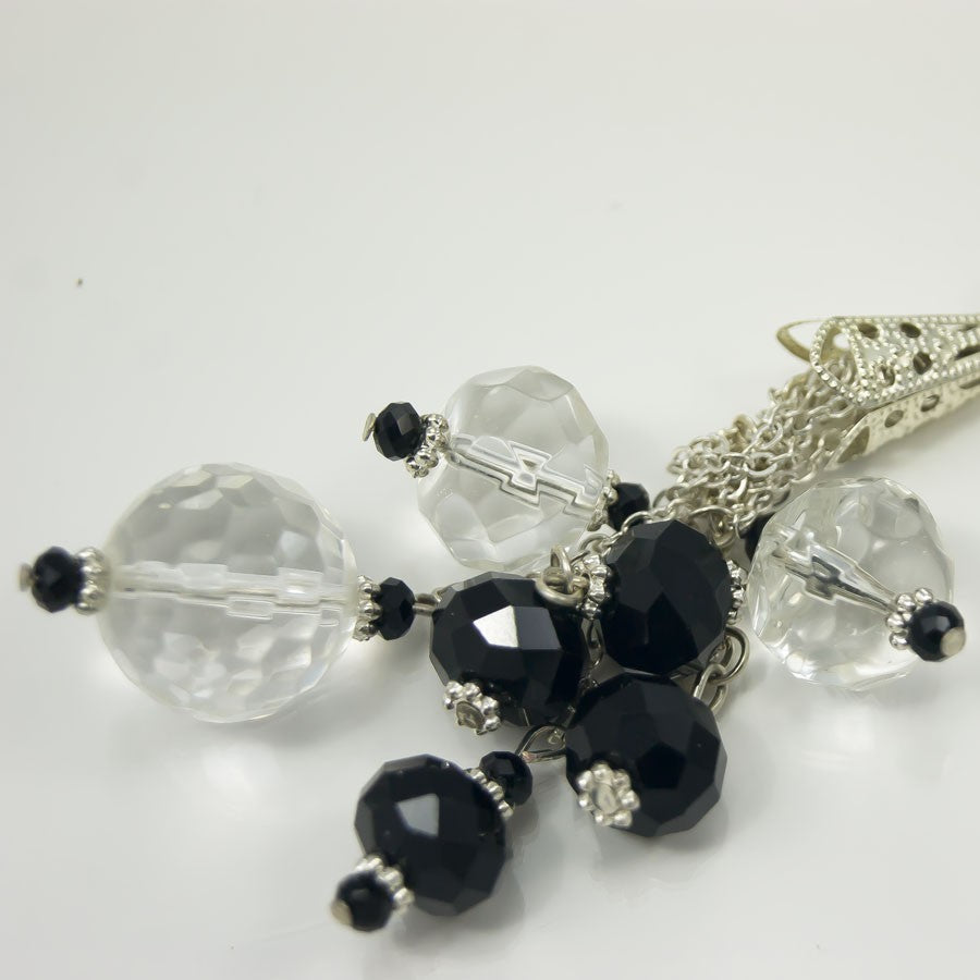 Collana LUCEOMBRA .005,  lunga, cristalli trasparenti e neri,  sottile catenella con pendente di cristalli.