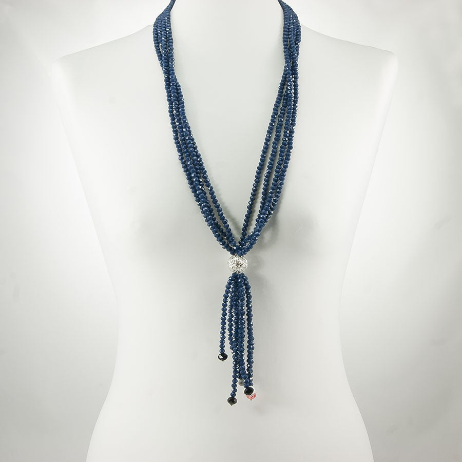 Collana I CRISTALLI .029, otto fili mezzi cristalli blu mare, elemento metallico traforato con ciondolo a fili.