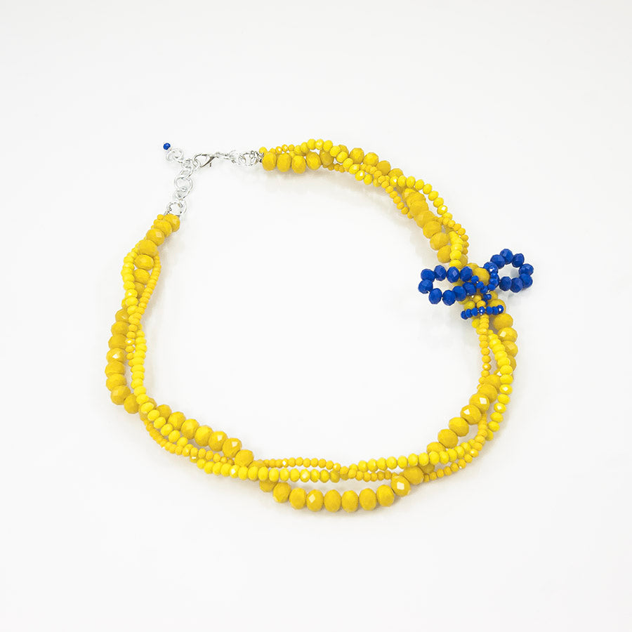 Collana SOPHIA i colori .023 Girocollo cristalli gialli intrecciati con fiocchetto cristalli blu.